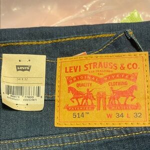 Levi's Dark Indigo Jeans with Yellow Stitching and Leather Patch